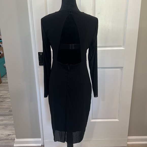 ⭐️SOLD⭐️ Bebe s black dress w/built-in bra,sheer sleeves, and open back. - Picture 7 of 8